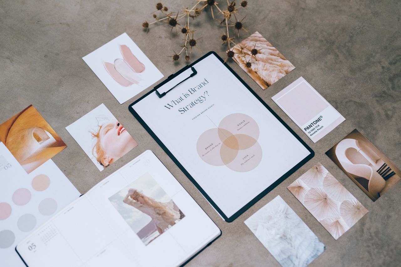 why-choose-us Flat lay of a minimalist brand strategy moodboard on a concrete surface.